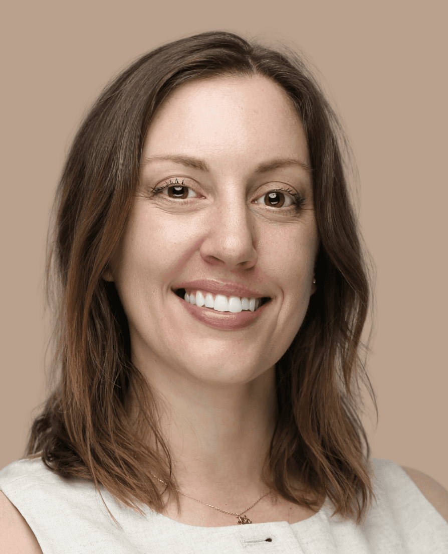 Kelly, founder of Thrive Beyond Coaching, smiling